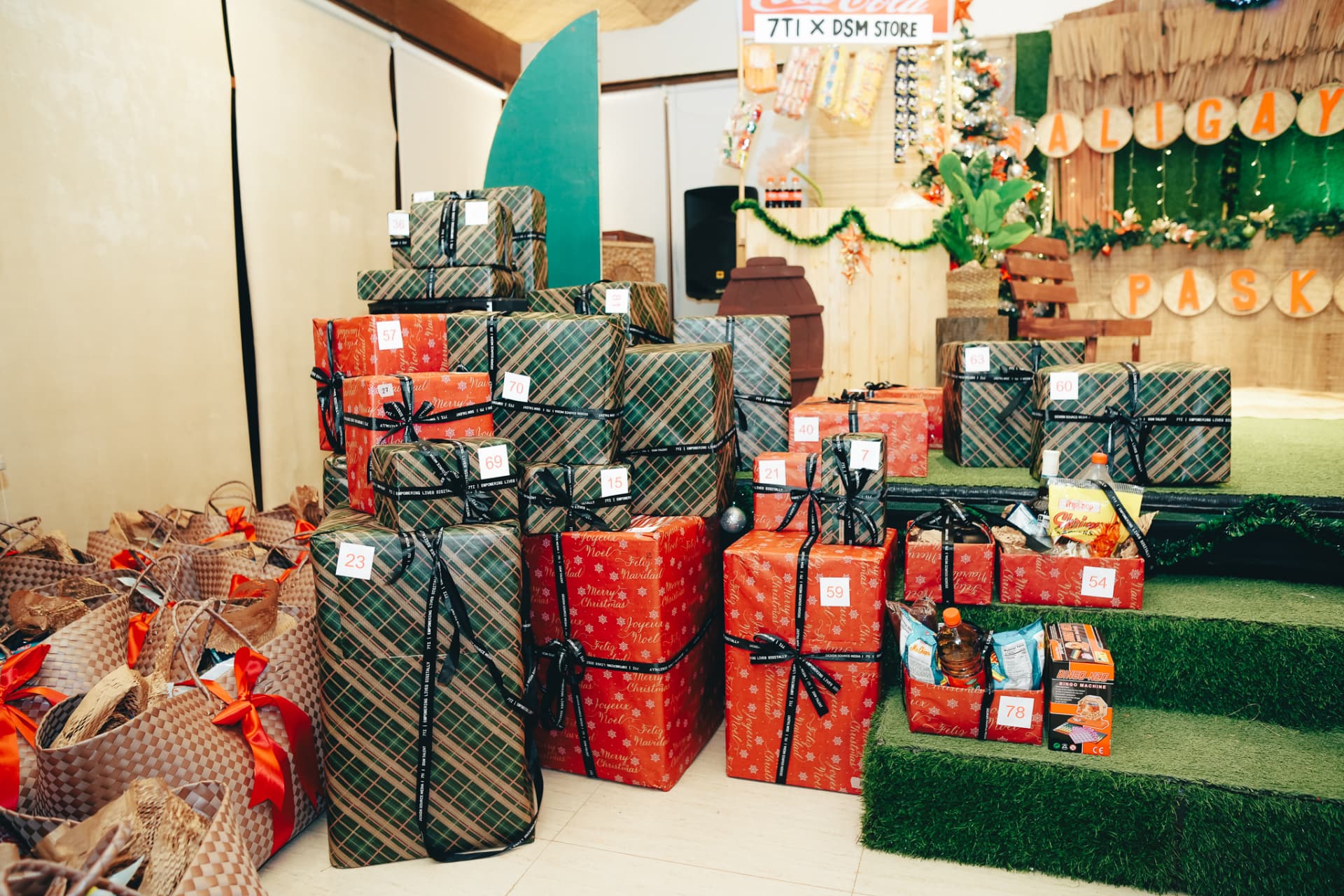 Piles of wrapped raffle prizes by the stage